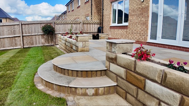 Bespoke curving sandstone steps with Yorkshire stone walling