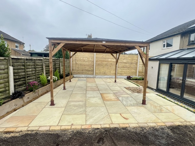 Mint sandstone flagged terrace edged with cobbles Mint sandstone flagged terrace edged with cobbles