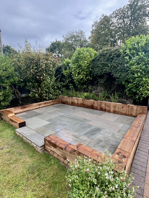 Raised Kandla grey Indian sandstone patio Raised Kandla grey Indian sandstone patio